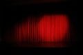 spotlight on a red stage curtain