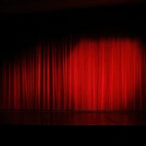 spotlight on a red stage curtain
