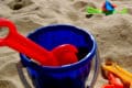 bucket and spade on sandy beach