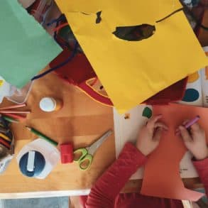 children cutting out coloured paper