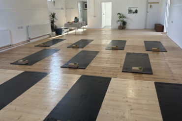 ems yoga studio with mats laid out ready for a class