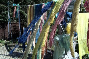 Dyed spinning yarn drying on a clothes line