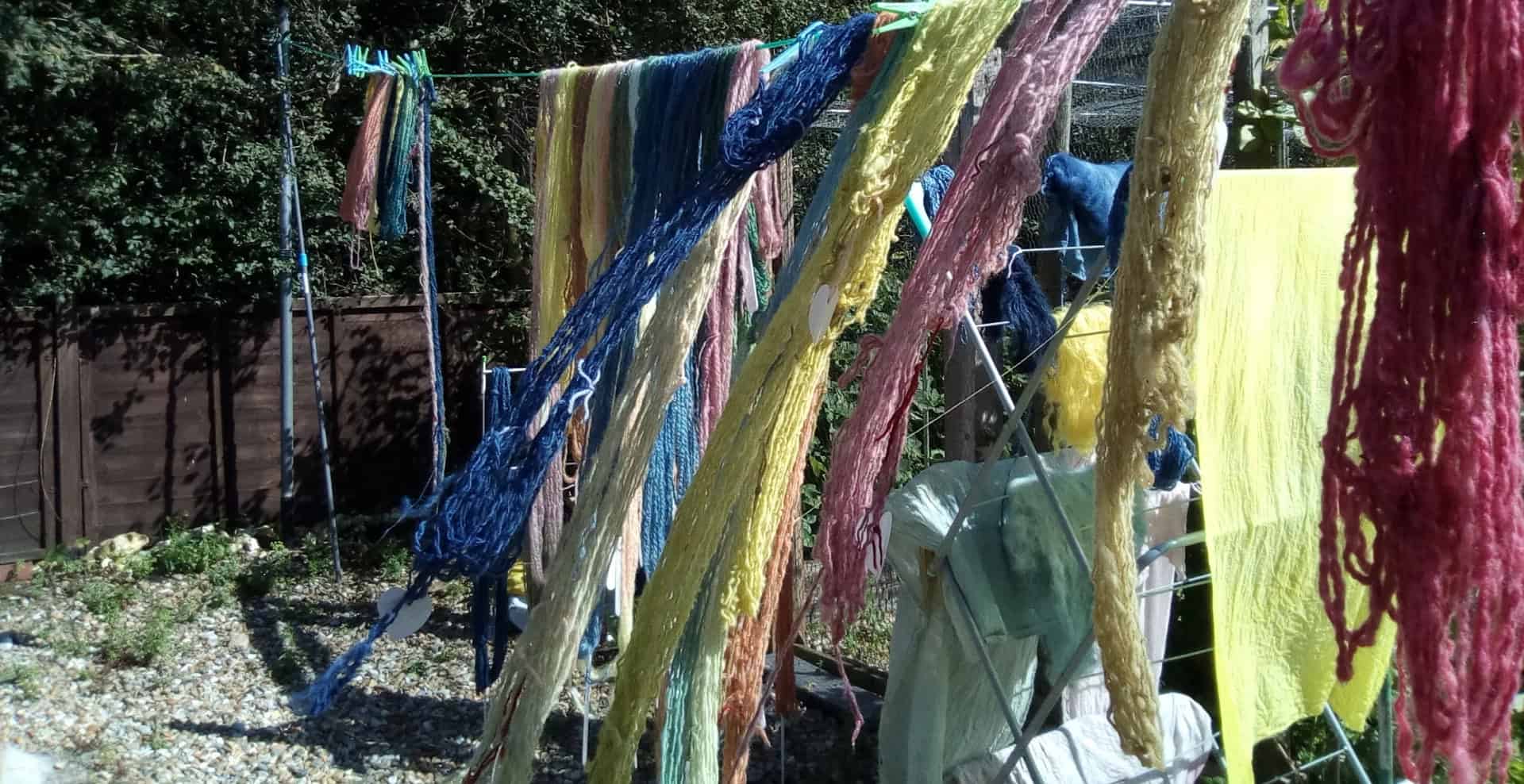 Dyed spinning yarn drying on a clothes line