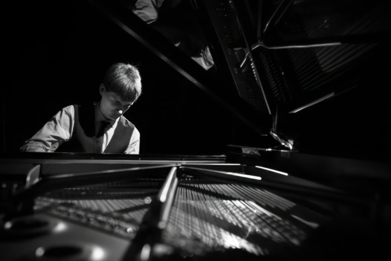 thomas luke playing the piano