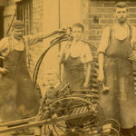‘Rural Wight In Bygone Days’ by Hilary Scammell (pub. IW Council): Frank Coombes Blacksmiths’ premises at Avenue Road, Sandown. The staff posing in their leather aprons are, left to right: Frank Coombes, Alan Butchers apprentice, Derek and Fred Cooper and the young Ken Locke in front, date c1910.