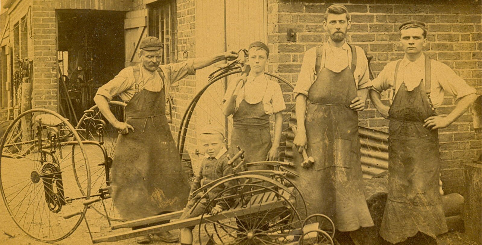 ‘Rural Wight In Bygone Days’ by Hilary Scammell (pub. IW Council): Frank Coombes Blacksmiths’ premises at Avenue Road, Sandown. The staff posing in their leather aprons are, left to right: Frank Coombes, Alan Butchers apprentice, Derek and Fred Cooper and the young Ken Locke in front, date c1910.