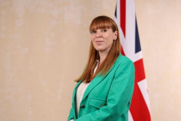 Angela Rayner standing in front of the union flag