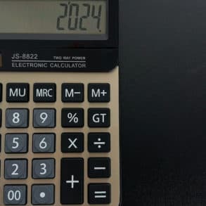 Desk calculator on dark background