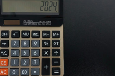 Desk calculator on dark background