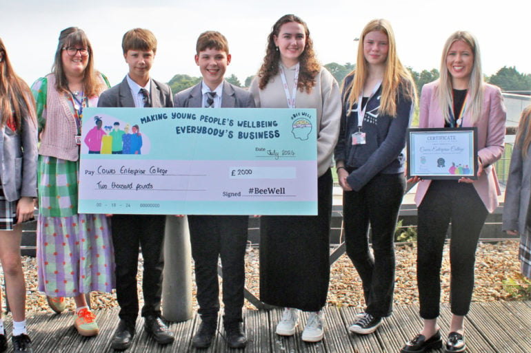 Students from Cowes with their giant cheque