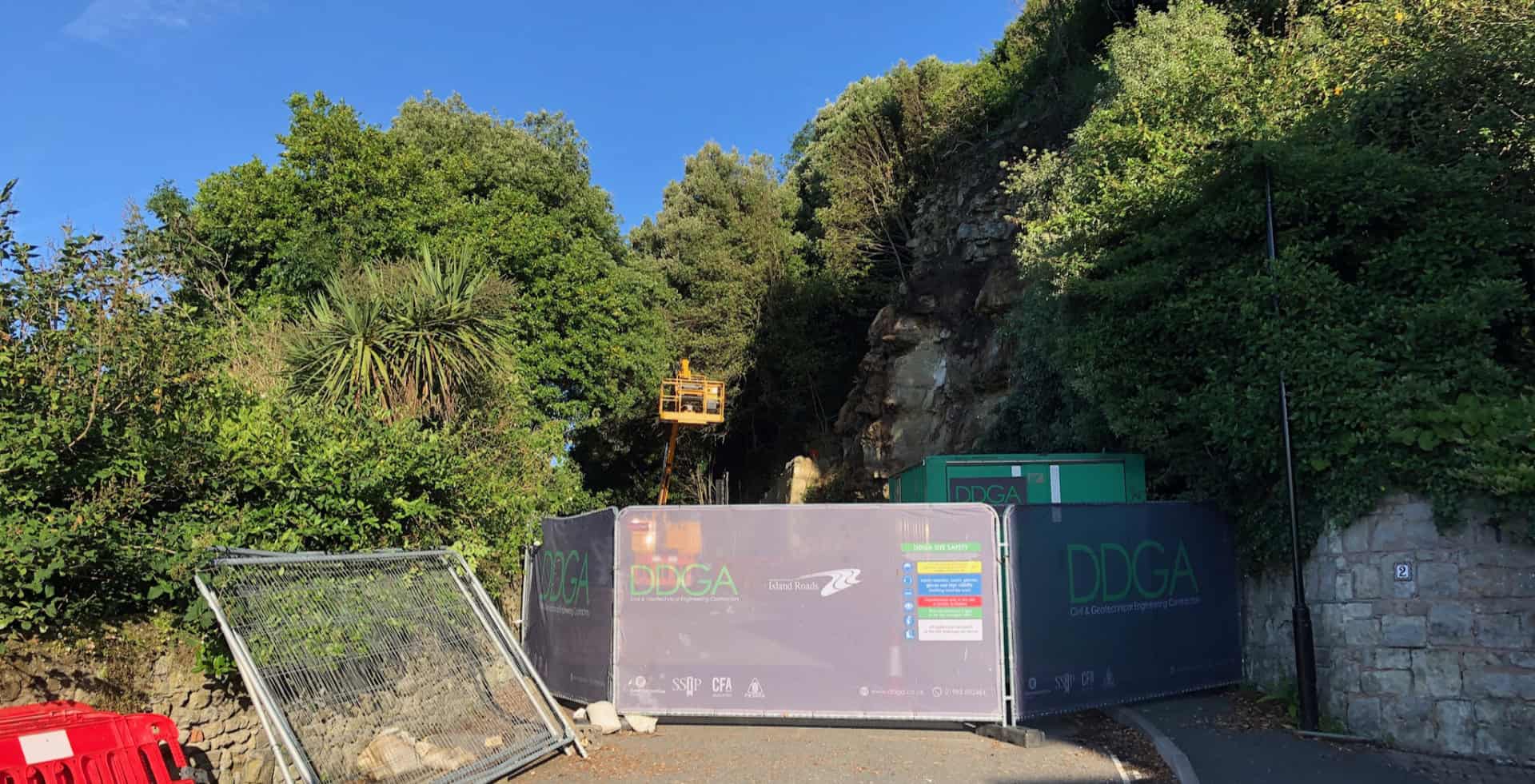 Gills Cliff Road with fencing across to stop traffic, cherry picker in the distance