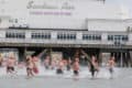 People taking part in the Pier to pier swim by running into the water by Sandown pier