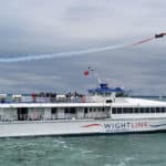 Red Arrow over a Wightlink FastCat