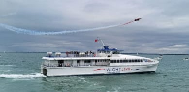 Red Arrow over a Wightlink FastCat