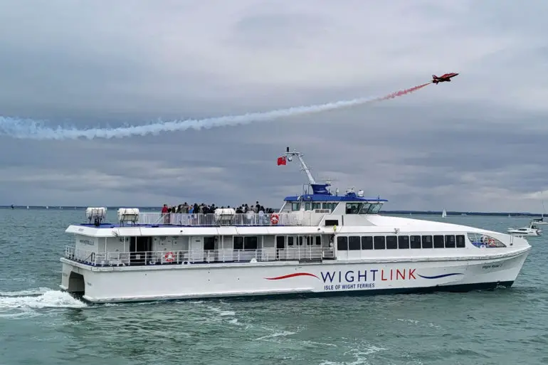 Red Arrow over a Wightlink FastCat