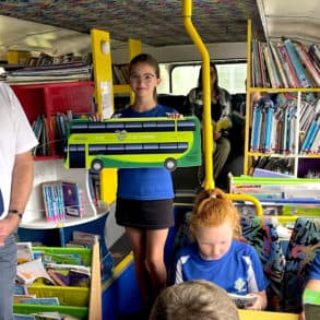 children on the school library bus