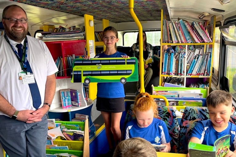 children on the school library bus