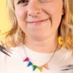 Woman wearing mini bunting necklace at Tatty Devine Fringe Workshop