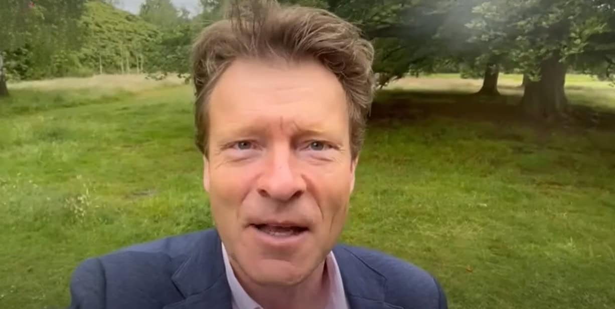 richard tice talking outdoors with greenery in the background