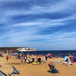 Busy Sandown Beach on a sunny day