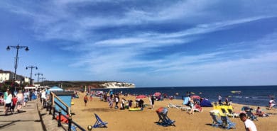 Busy Sandown Beach on a sunny day