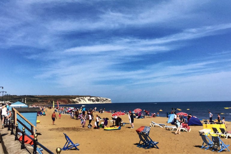 Busy Sandown Beach on a sunny day