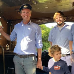 Joe Robertson and his son on the footplate of Calbourne with driver Steve and fireman Matt.