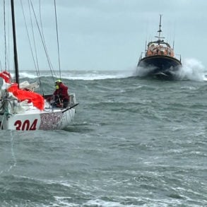 French sailor being towed away from tidal races off St Catherine's