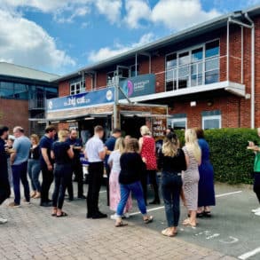 Glanvilles staff outside their offices eating from a food van