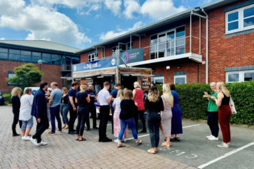 Glanvilles staff outside their offices eating from a food van