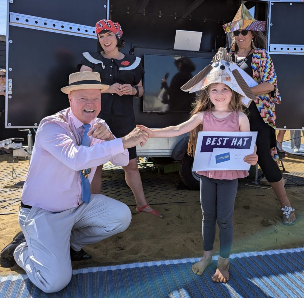 Judges Karl Love, Rosie Wolfenden and Dadina Sagger chose this young entrant as winner of Best Hat created by under-12s (photo by Tracy Mikich)