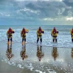 Sandown and Shanklin Independent Lifeboat Crew lined up on the beach for Volunteers Week