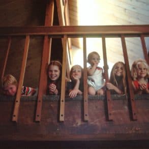 eight children looking through bannisters by national cancer institute