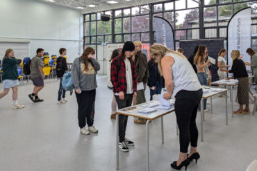 island vi form students collecting their results