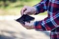 man showing his empty wallet