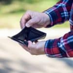 man showing his empty wallet