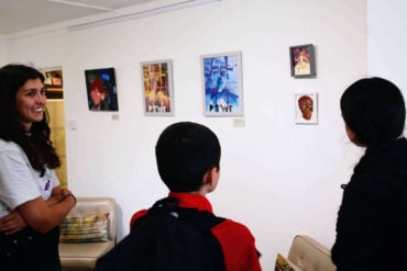 people looking at the Young Artist Award Exhibition