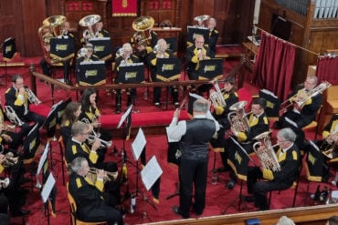 Abbey Brass performing in a church