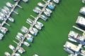 Aerial view of boats moored in a marina - andy wang