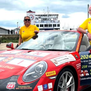 Belinda and James Richardson with their Porsche bhy Wightlink ferry terminal