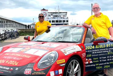 Belinda and James Richardson with their Porsche bhy Wightlink ferry terminal