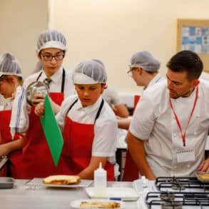 CEC Students cooking with Robert Thompson on TV show