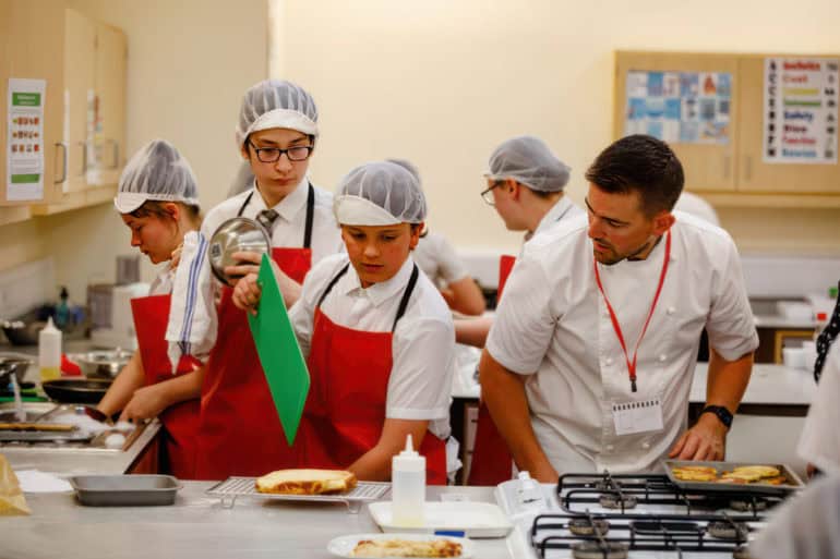 CEC Students cooking with Robert Thompson on TV show