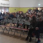 Cowes School Meeting - showing parents sitting in chairs waiting for the meeting to begin