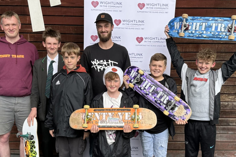 John Cattle's Skate Club members with their skateboards