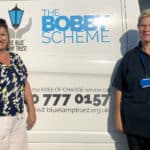 Lisa and Lois standing by Blue Lamp Trust van