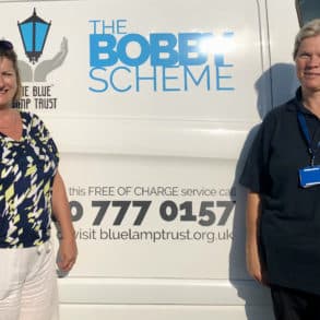 Lisa and Lois standing by Blue Lamp Trust van