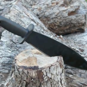 Machete knife in a log