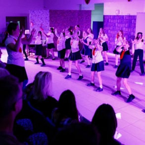 Pupils performing on stage