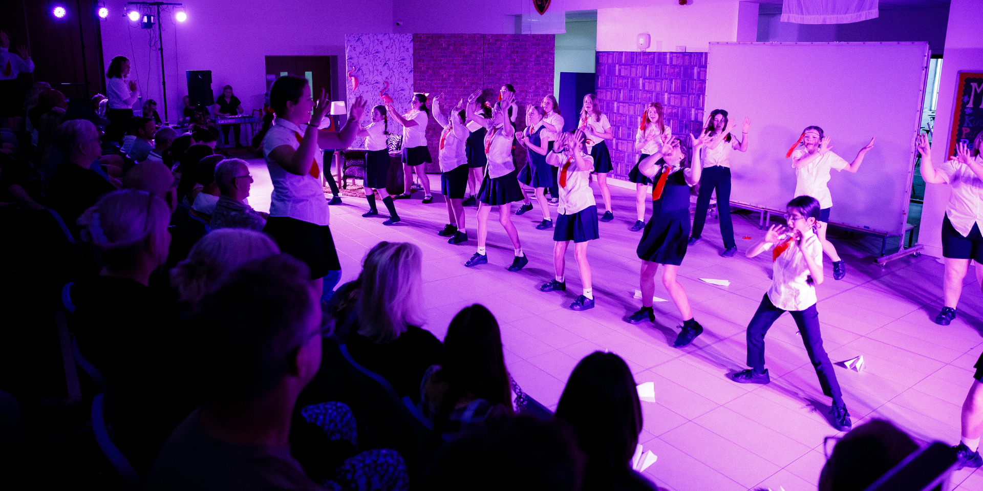 Pupils performing on stage